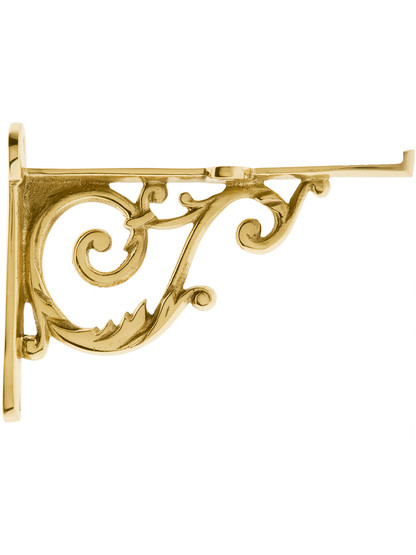 Small Cast Brass Scroll Shelf Bracket In Polished Brass.